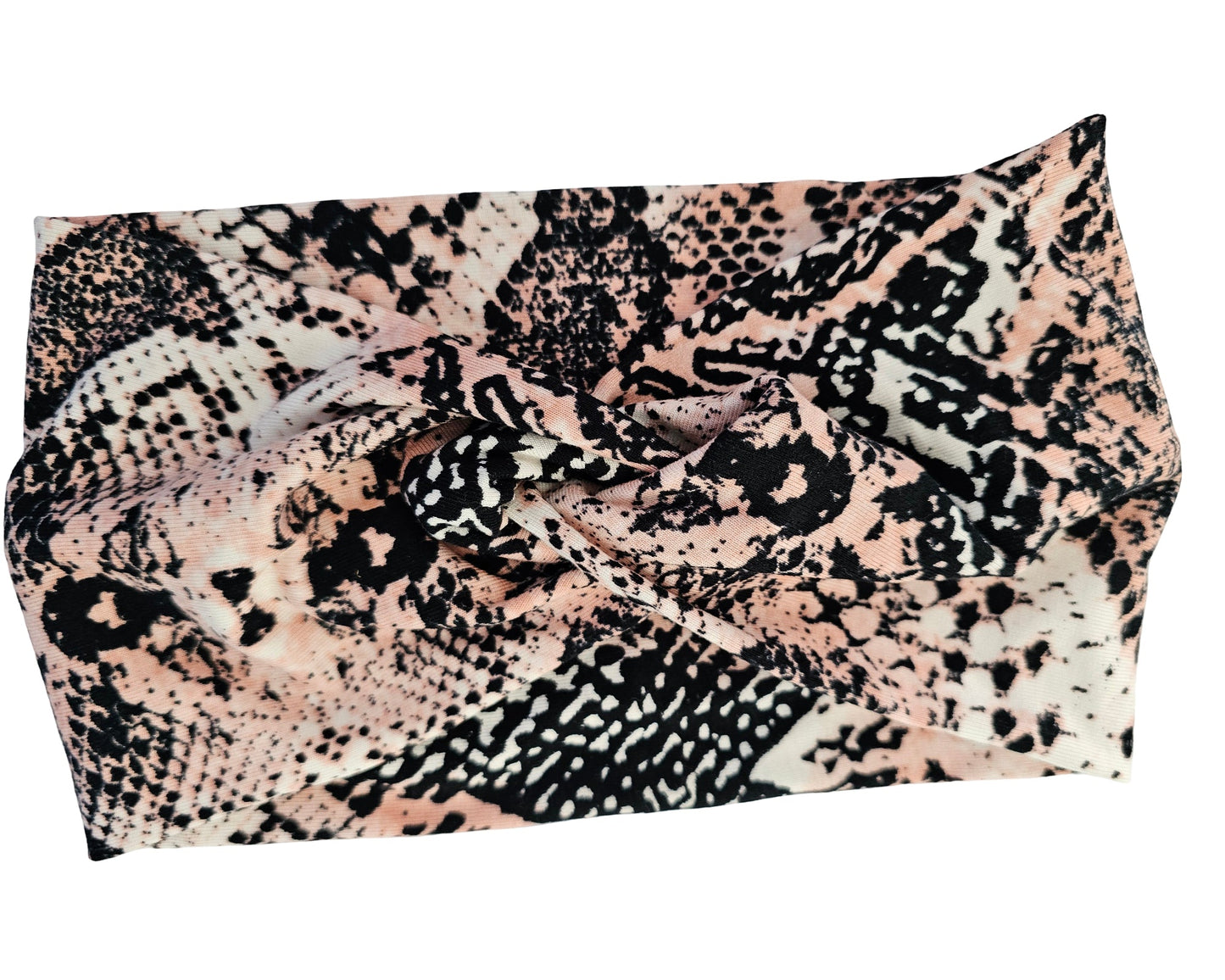 Patterned scarf with black, white, and pink design on a white background