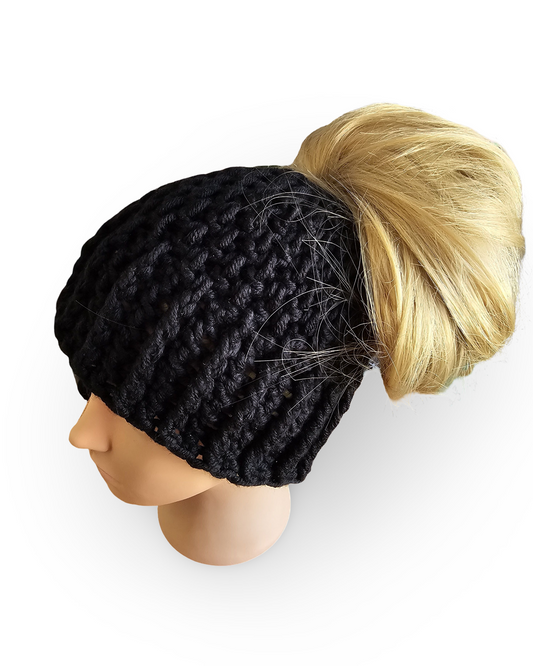 Black knit beanie with a blonde wig on a mannequin head against a white background