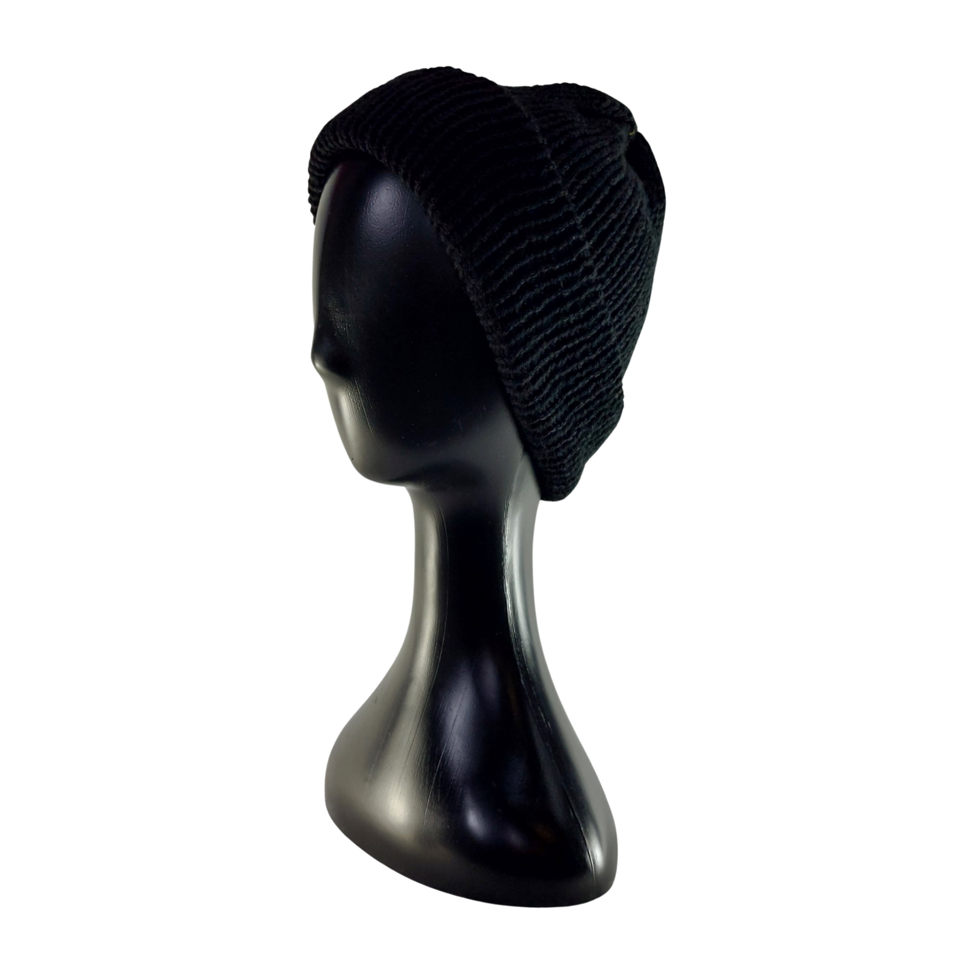Black knit beanie on a mannequin head against a white background