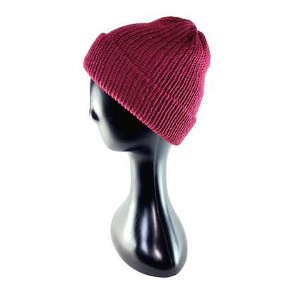 Maroon knit beanie on a black mannequin head against a white background