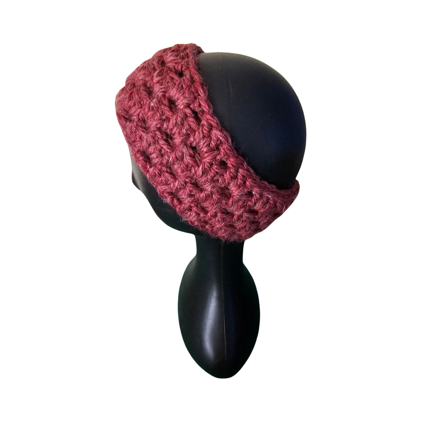 Pink knitted headband on a black mannequin head against a white background