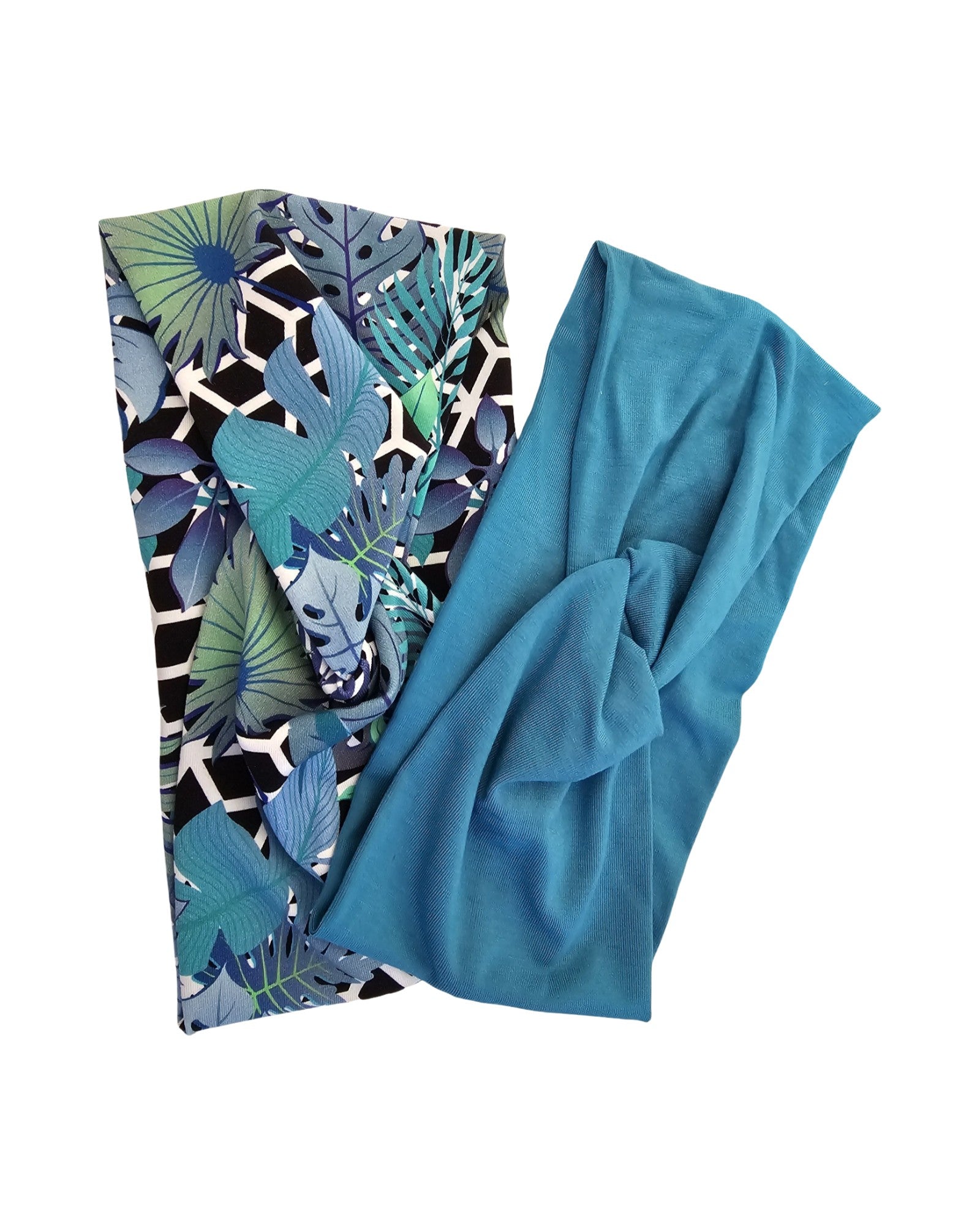 Teal fabric with a tropical leaf pattern on a white background