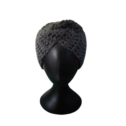 Dark gray knitted headband on a black mannequin head against a white background