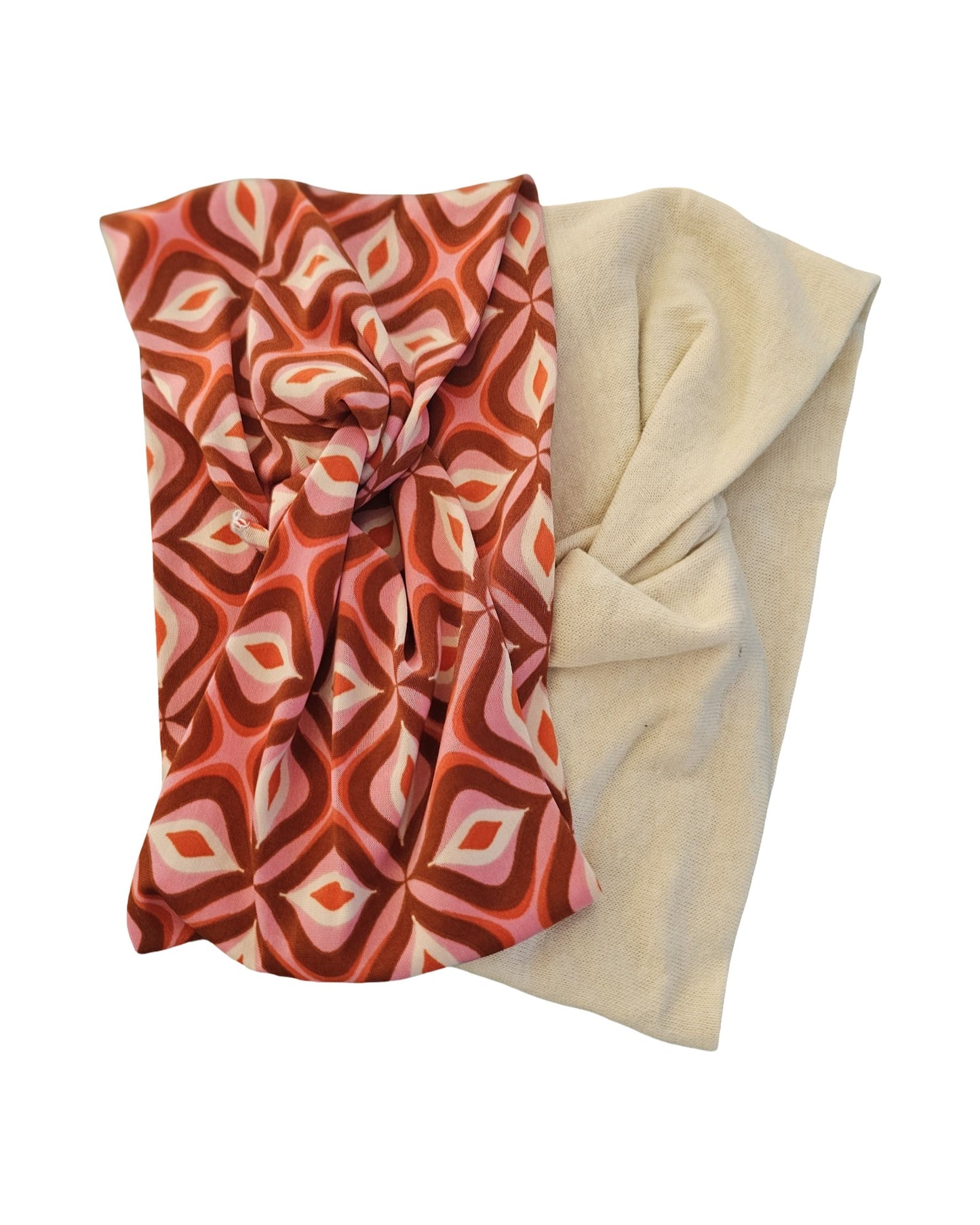 Two scarves, one with a red and orange geometric pattern and the other beige, on a white background.