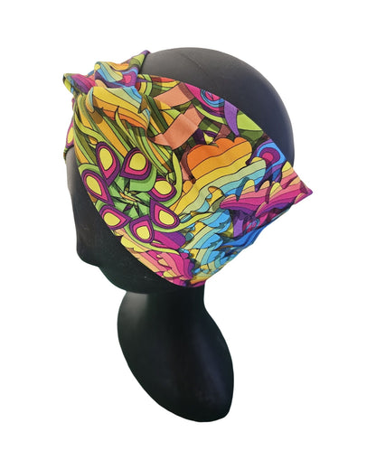 Colorful woman's knotted headband with abstract pattern on a mannequin head against a white background