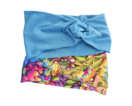 Blue towel with colorful abstract pattern on a white background