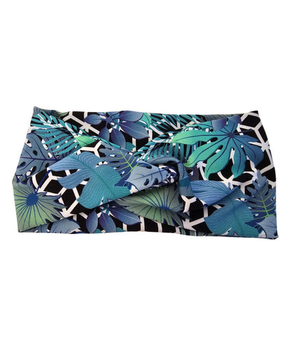 Folded fabric with blue and green leaf pattern on a white background