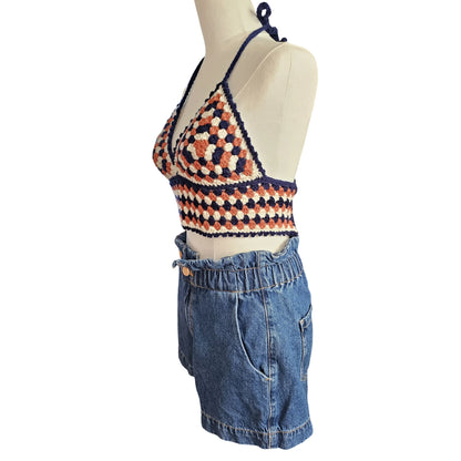 Crochet top showcase on a mannequin with white background