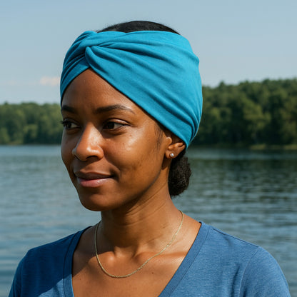 Aqua knotted headband on models head at the lake