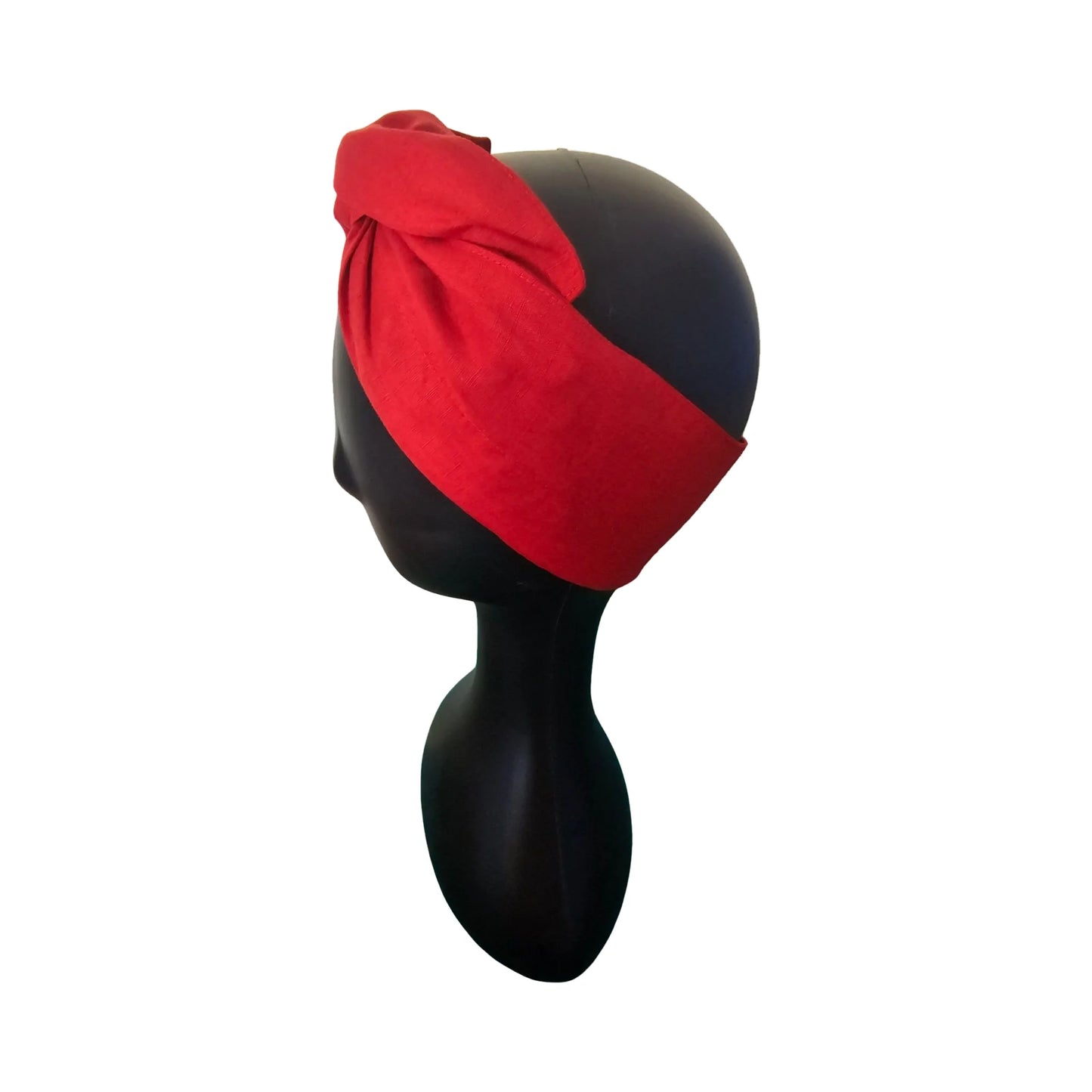 Red woman easy to style wire headband wire on a black mannequin head against a white background side view