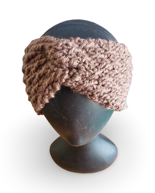 Knitted headband on a mannequin head against a white background