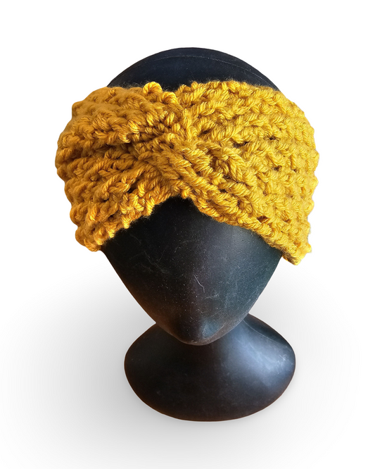 Yellow knitted headband on a black mannequin head against a white background