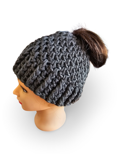 Gray knit beanie with a pom-pom on a mannequin head against a white background